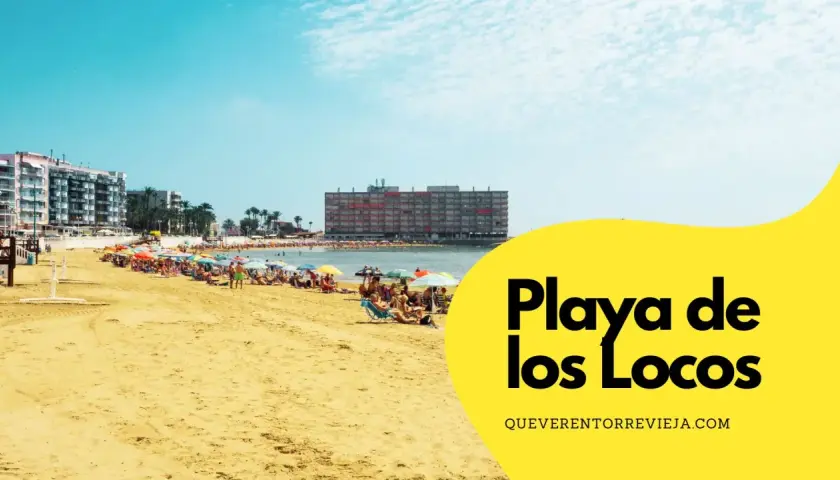Gente disfrutando del sol y el mar en la **Playa de los Locos**, con sombrillas de colores y edificios al fondo.