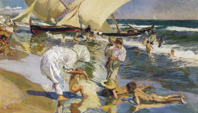 Escena playera de "Paseo a orillas del mar" de Sorolla, obra maestra del **museo Sorolla Valencia**. Niños juegan en el agua y la arena, con barcas al fondo.