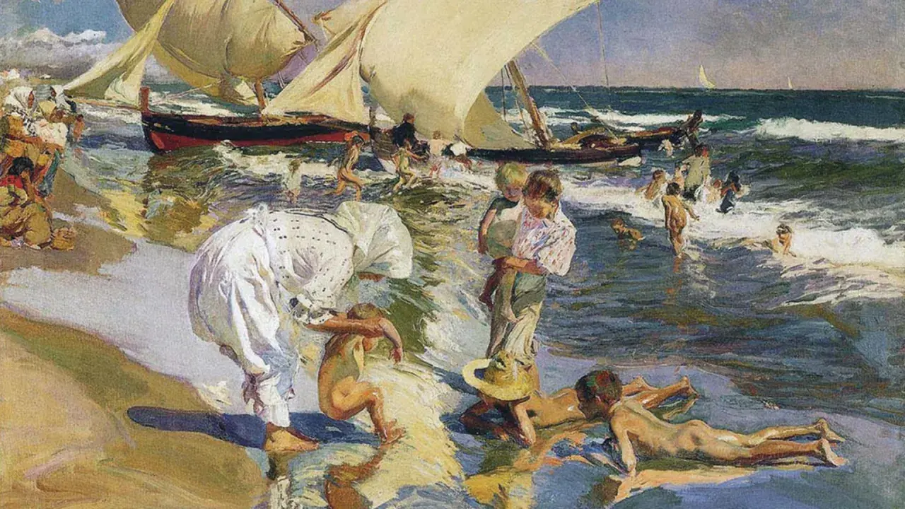 Escena playera de "Paseo a orillas del mar" de Sorolla, obra maestra del **museo Sorolla Valencia**. Niños juegan en el agua y la arena, con barcas al fondo.